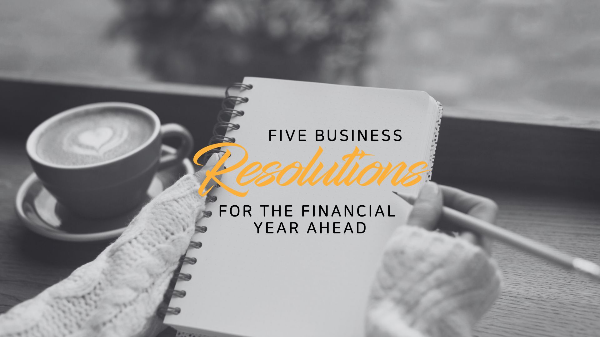 Image of woman with notebook and the text five business resolutions for the financial year ahead