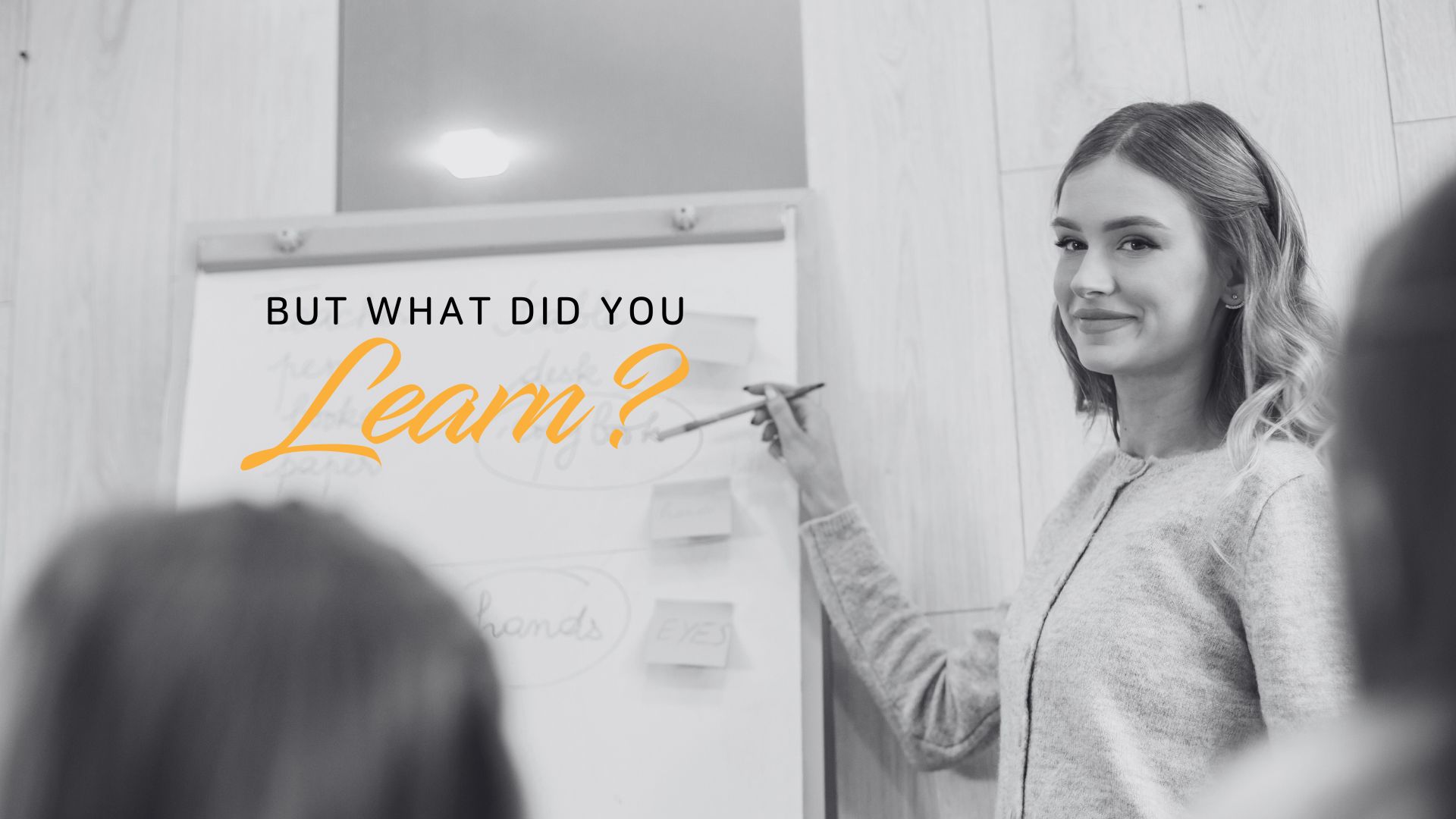Woman at a blackboard with the text But what did you learn?
