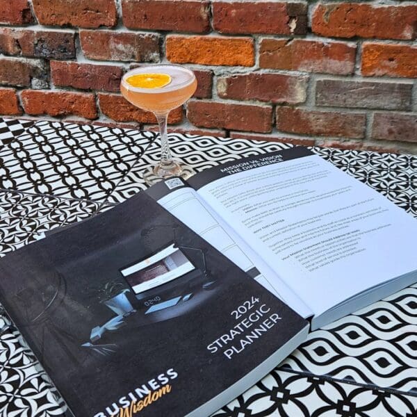 A book with The Strategic Planner on a table.